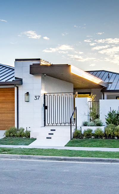 cropped street view of front gate entry of Newport contemporary project in Coronal Del Mar